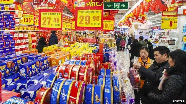 Customers choose goods at a supermarket in Lianyungang, Jiangsu province 09/02/2015