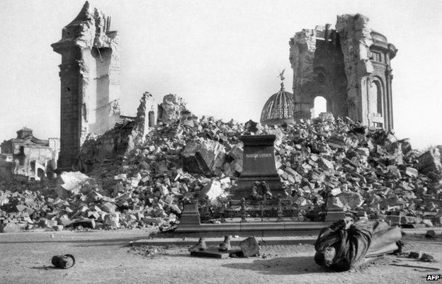 Dresden's Frauenkirche (Church of Our Lady) and the destroyed Martin-Luther-Memorial in February 1945