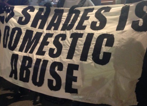 banner reading 50 shades is domestic abuse