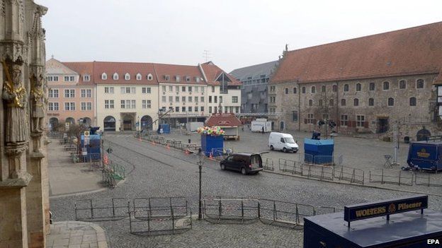 The square is sealed off in Braunschweig, Germany, on Sunday after the annual carnival procession was cancelled shortly before it was due to begin over fears of a terrorist attack