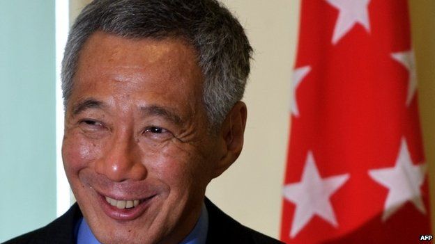 In this file picture taken on April 7, 2014, Singapore Prime Minister Lee Hsien Loong smiles as he speaks during a joint press conference at the prime minister"s office in Malaysia"s administrative capital in Putrajaya