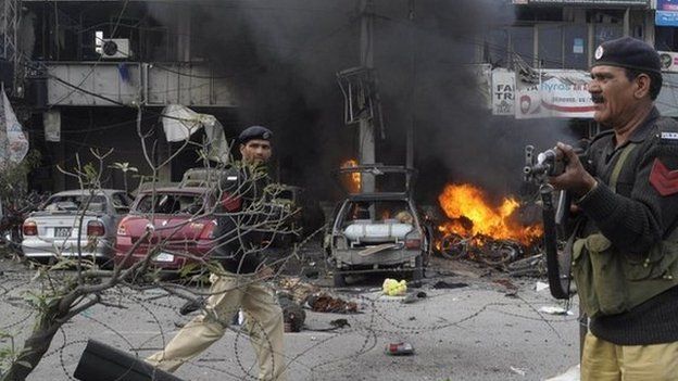 Pakistani policemen arrive at the site of a bomb explosion in Lahore on 17 February 2015.