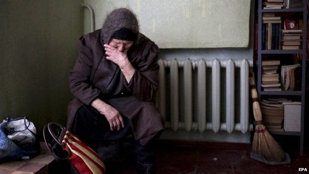 An elderly woman sits in the local Palace of Culture which is used as a bomb shelter in Mironovka village, near Debaltseve of Donetsk area, Ukraine, 17 February