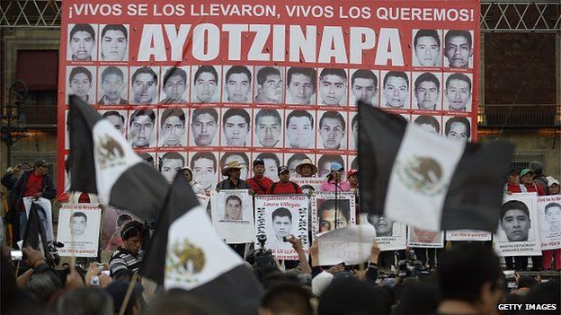 People take part in a march commemorating four months of the disappearance of 43 students from Ayotzinapa, on January 26 at the Zocalo square in Mexico City.