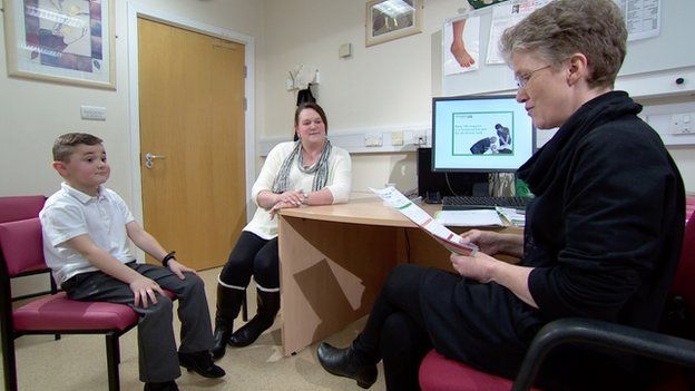 Dr Karen Horridge with a patient, Matthew and his mum