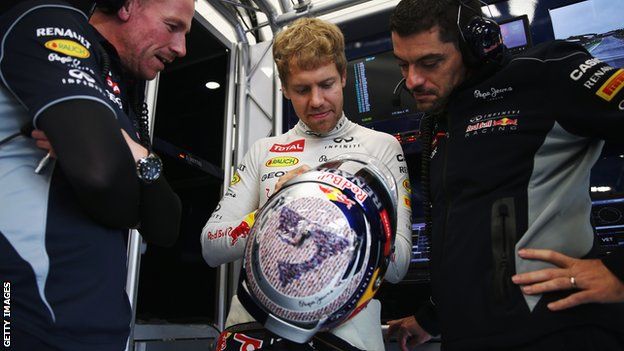 F1 world champion Sebastian Vettel with a specially-designed helmet at the 2013 British Grand Prix