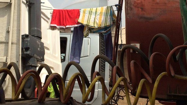 Washing drying on a truck at Ogbere Trailer Park in Ogun state, Nigeria - February 2015