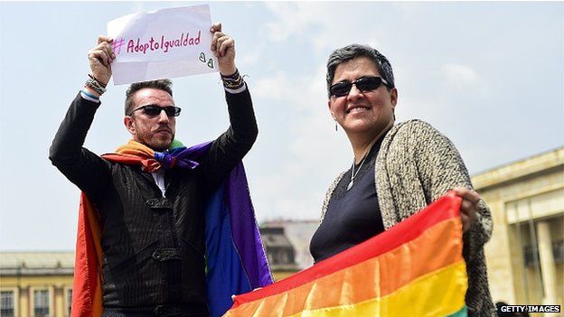 Activists protests outside the Supreme Court of Justice in Bogota demanding the legalisation of the adoption of children by same-sex couples on 18 February, 2015.