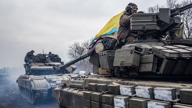 Ukrainian troops drive tanks out of Debaltseve. 19 Feb 2015