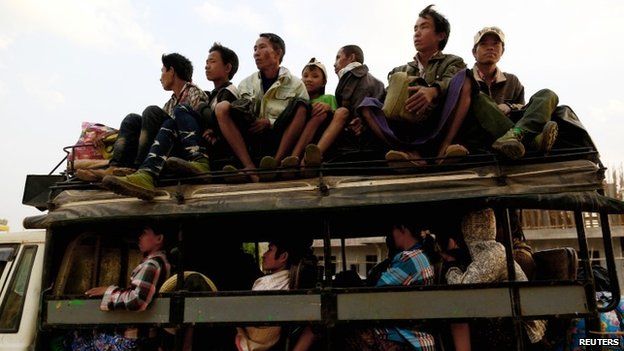 A vehicle carrying refugees from Laukkai arrives to a temporary refugee camp at a monastery in Lashio February 19, 2015