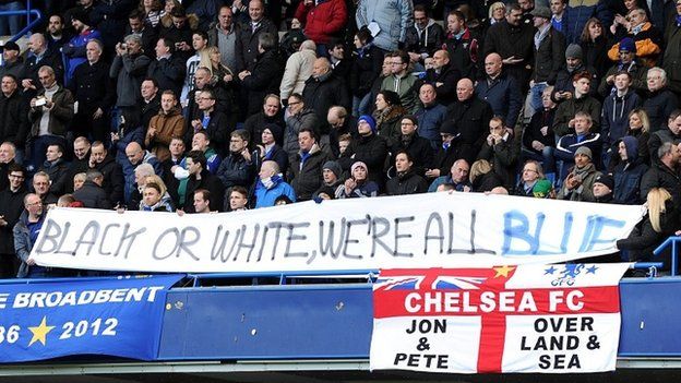 Chelsea fans holding a banner promoting equality at Stamford Bridge