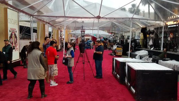 Clear plastic tents put up over the red carpet at the Oscars