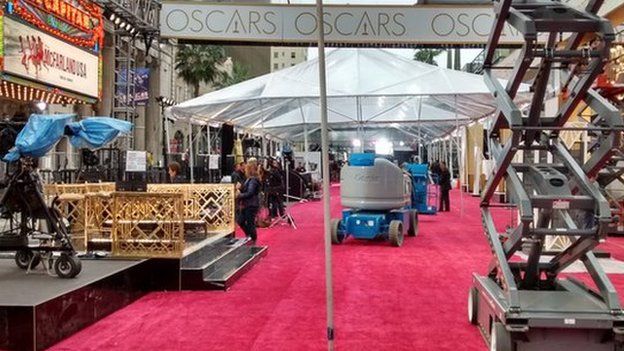 The Oscars red carpet - seen a day before the event with staff putting the surrounding structures together