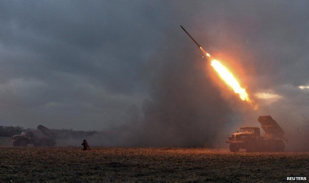 Ukrainian servicemen launch a Grad rocket towards pro-Russian separatist forces outside Debaltseve, 8 February