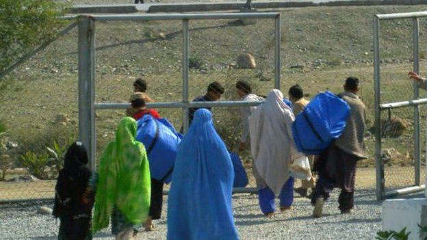 Afghan refugees are passing the Torkham border crossing into an uncertain future