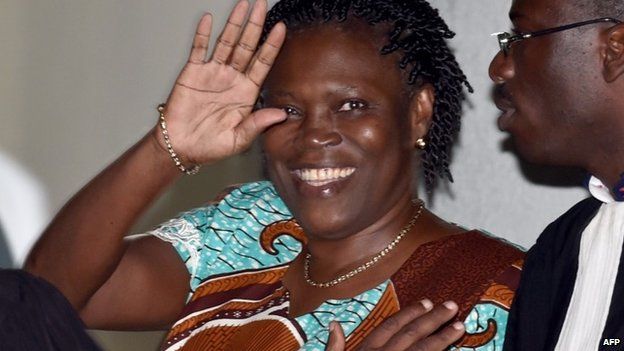 Ivory Coast"s former first lady Simone Gbagbo waves as she arrives at the Court of Justice in Abidjan, on February 23, 2015