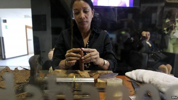A woman assembles a cigar during the opening day of 17th Cigar Festival and Commercial Fair in Havana, Cuba, 23 February 2015