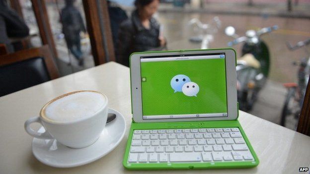 This photo illustration taken on March 12, 2014 shows the logo of Chinese instant messaging platform called WeChat on a mobile device which has taken the country by storm in just three years.