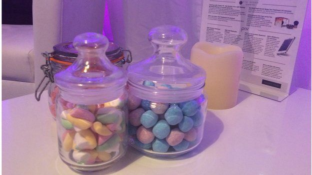 Jars of sweets, a candle and a spa menu backstage at the Brit Awards