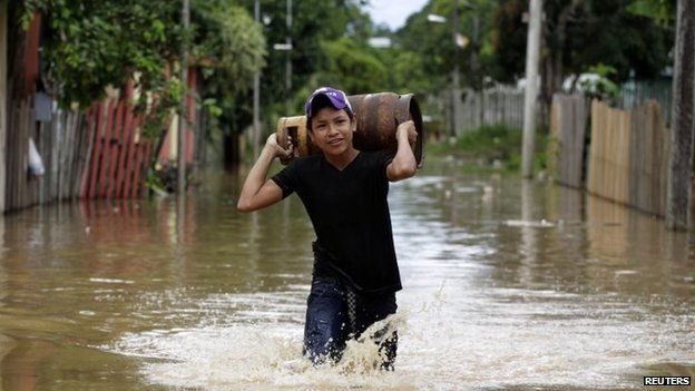 A boy carries a gas cylinder in Cobija on 24 February, 2015