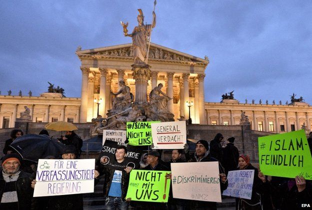 Protesters hold banners during the demonstration under the slogan "New Islam Law? Not with us!" in front of the parliament building in Vienna, Austria, 24 February 2015