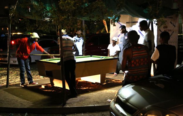 Playing pool in a car park