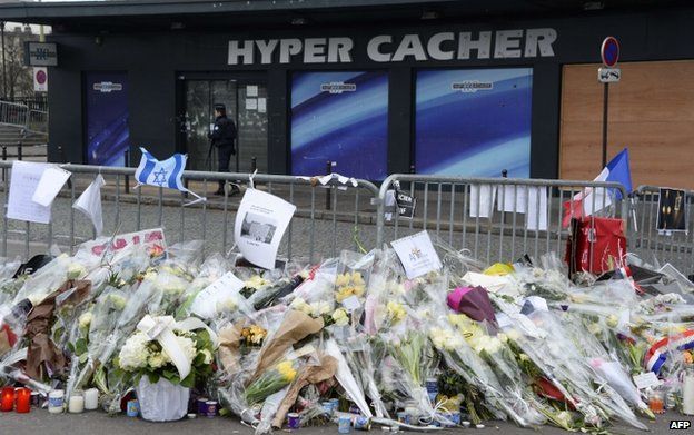 Flowers and tributes outside the Jewish supermarket attacked by gunman Amedy Coulibaly in January 2015