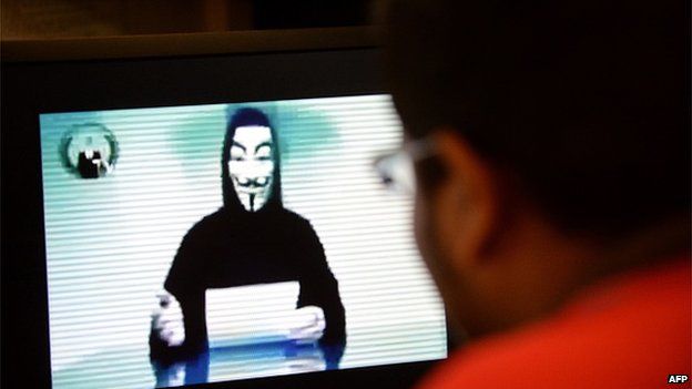 A person claiming to speak for activist hacker group Anonymous is seen issuing a warning thought a video circulated online to 'go to war' with the Singapore government over recent Internet licensing rules on November 1, 2013.
