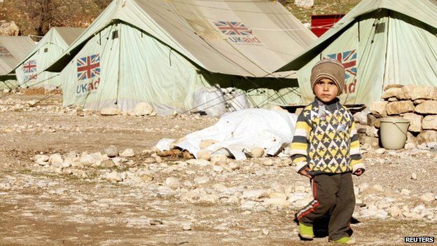 A displaced boy from the minority Yazidi sect walks in a refugee camp in Shikhan January 19, 2015.