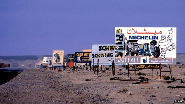 Roadside adverts along a desert road