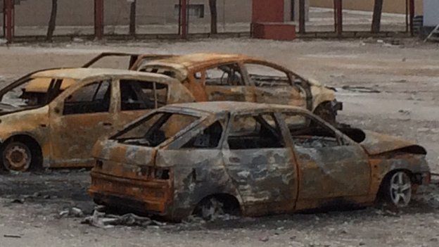 Burnt out cars in Mariupol