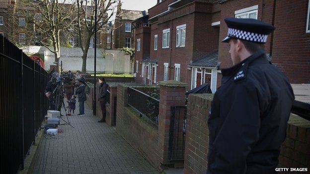 Police and TV crews outside an address in London where Emwazi is believed to have lived