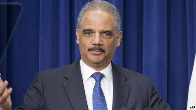 Attorney General Eric Holder speaks to law enforcement officers and guests in the Old Executive Office Building on the White House Complex in Washington 11 February 2015