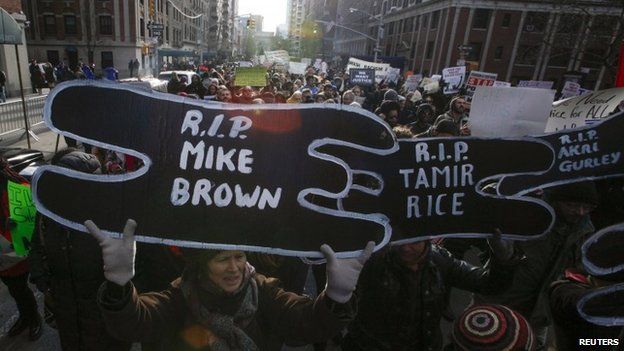 People take part in a march against police violence, in New York 13 December 2014