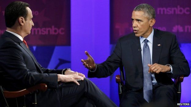 US. President Barack Obama (R) participates in the taping of an MSNBC/Telemundo town hall discussion on immigration with host Jose Diaz-Balart (L) at Florida International University in Miami, 25 February 2015