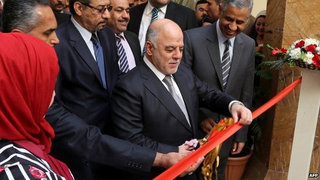 Iraqi Prime Minister Haider al-Abadi (C) attends the reopening ceremony of Iraq's national museum on February 28, 2015