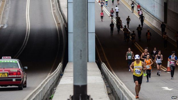 Competitors run in Hong Kong"s first inner city ultra marathon on March 1, 2015