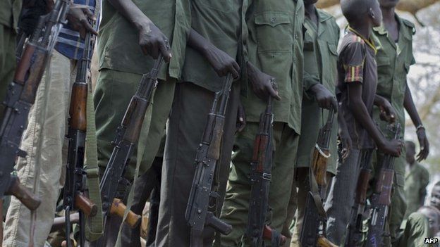 Child soldiers prepare to lay down their arms at a ceremony in South Sudan