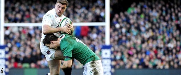 Ireland's Jonathan Sexton (R) tackles England's George Ford