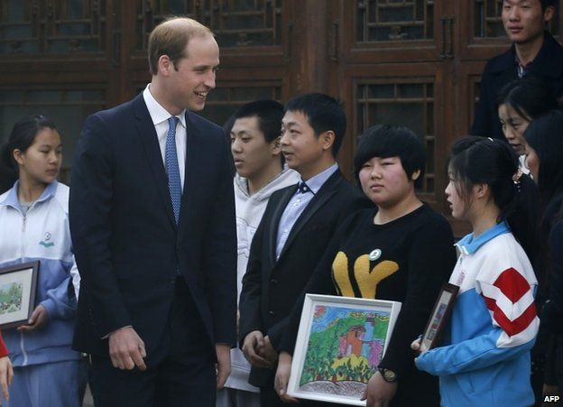 Prince William meets young people during a visit to the Shijia Hutong Museum in Beijing on 2 March 2015