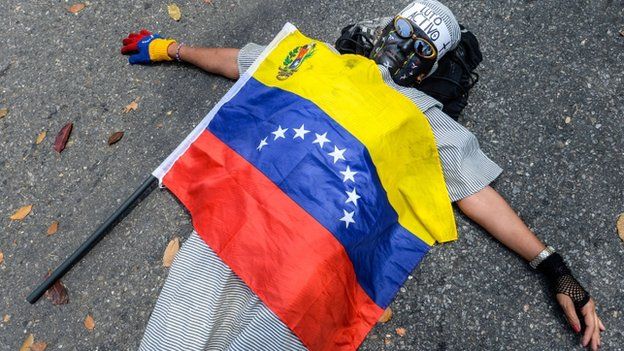 Oposition activist participates in march in protest against the death of a student occurred during a demonstration in the state of Tachira