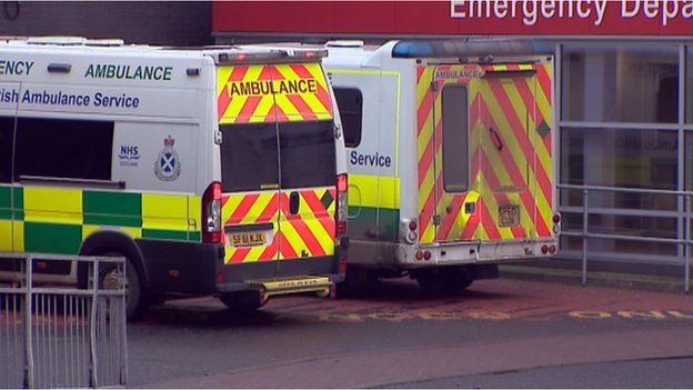 Ambulances wait outside an emergency department