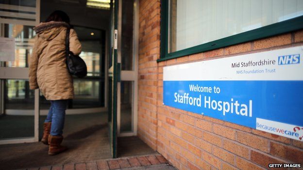 Person walking into Stafford Hospital in February 2013