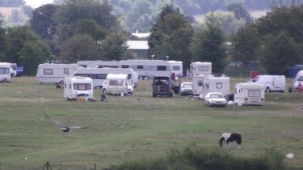 Travellers in a field