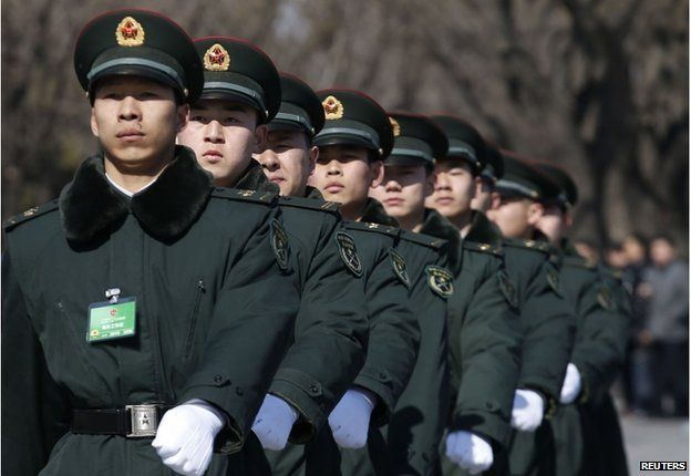Soldiers from China's People's Liberation Army (PLA) march ahead of the opening session of Chinese People's Political Consultative Conference (CPPCC) at Tiananmen Square in Beijing, 3 March 2015