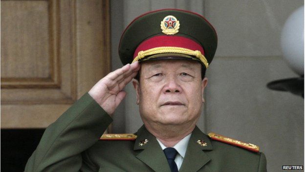 China's Central Military Commission Vice Chairman General Guo Boxiong stands at attention during the playing of the national anthem before a meeting at the Pentagon in Washington 18 July 2006.