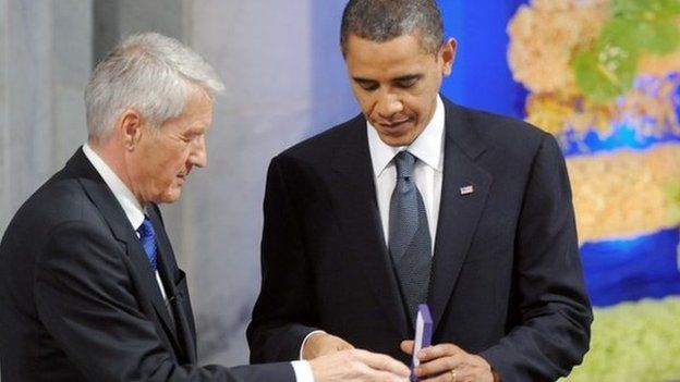 Norwegian Nobel Peace Prize Committee chairman Thorbjoern Jagland handing the diploma and medal to Nobel Peace Prize laureate, US President Barack Obama