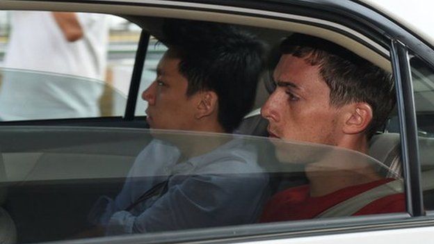 Andreas Von Knorre, one of the two German nationals arrested in Singapore for vandalism, arrives in a police car to the state court on 22 November 2014