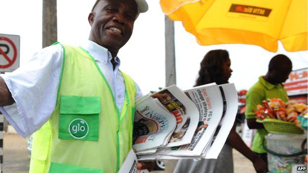 A newspaper vendor in Nigeria in 2013