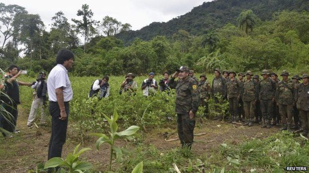 President Evo Morales receives a report from a member of the task forces on eradicating the illegal coca plants in Carrasco on 20 December, 2014.